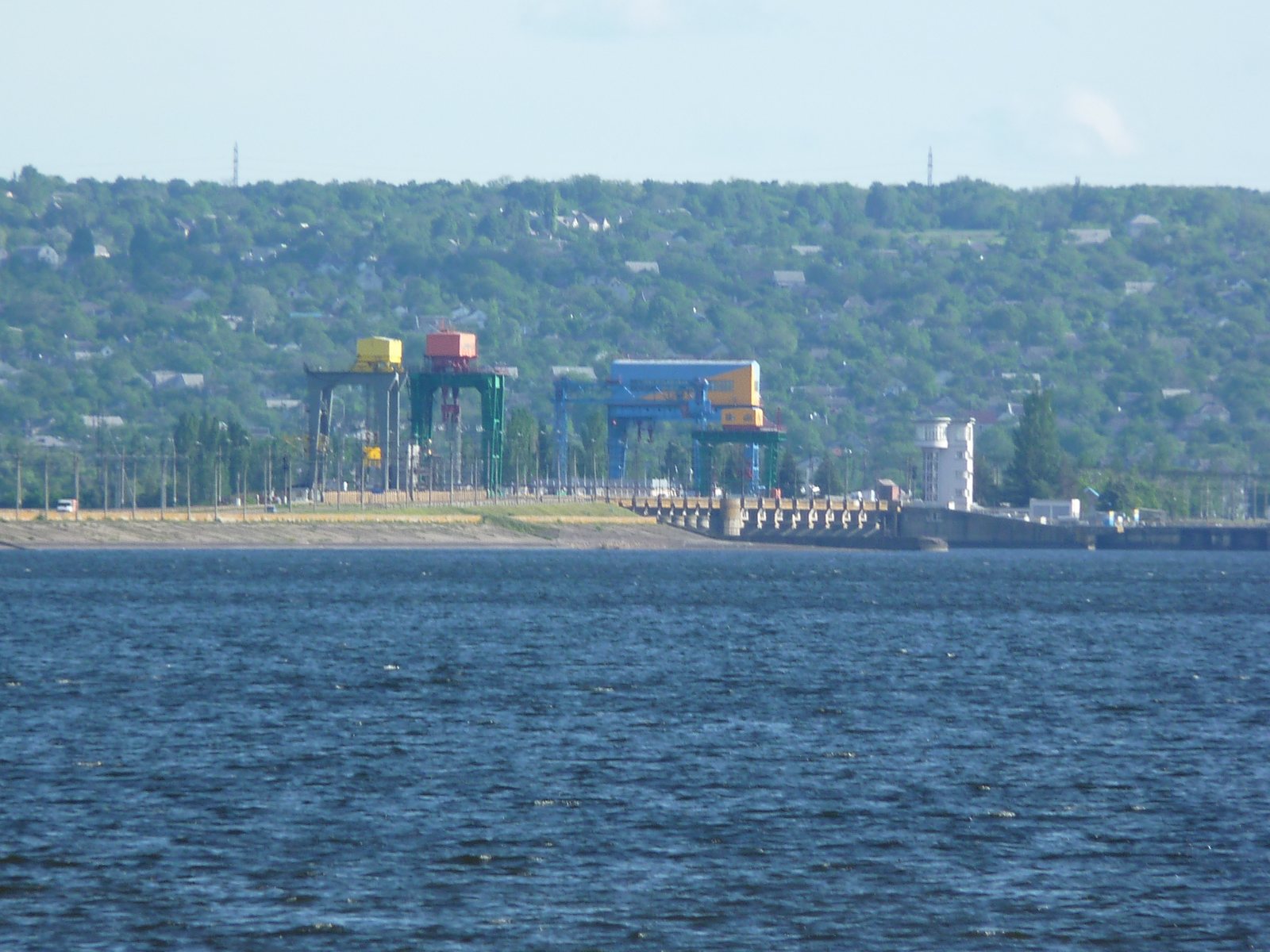 The station's gantry cranes and powerhouse seen from the Dnipro.